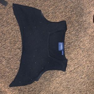 Never Worn Cropped black shirt with black hem details.